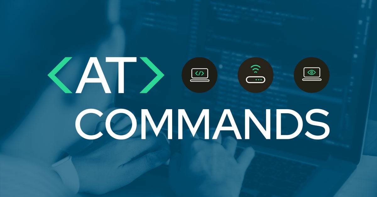 Engineer typing AT commands on a computer to configure IoT connectivity.