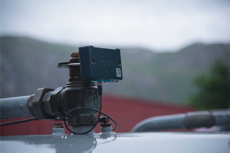 Soolo IoT sensor mounted on an industrial tank, measuring and transmitting real-time liquid level data for remote monitoring