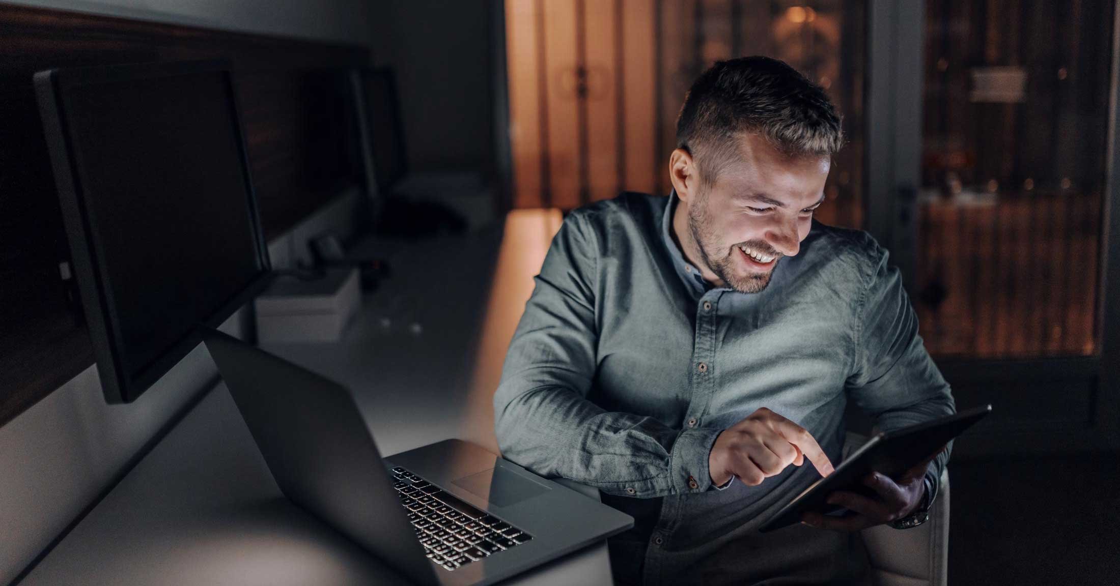 Developer-working-on-tablet-and-laptop