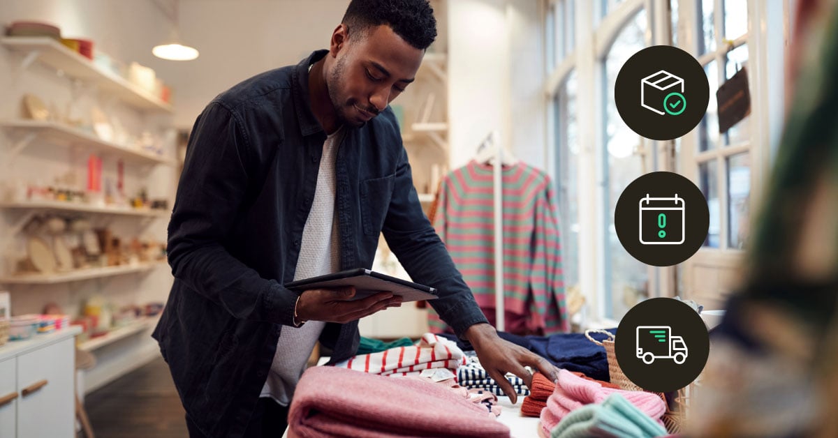 Retail manager using tablet to track IoT-connected sensors and store performance