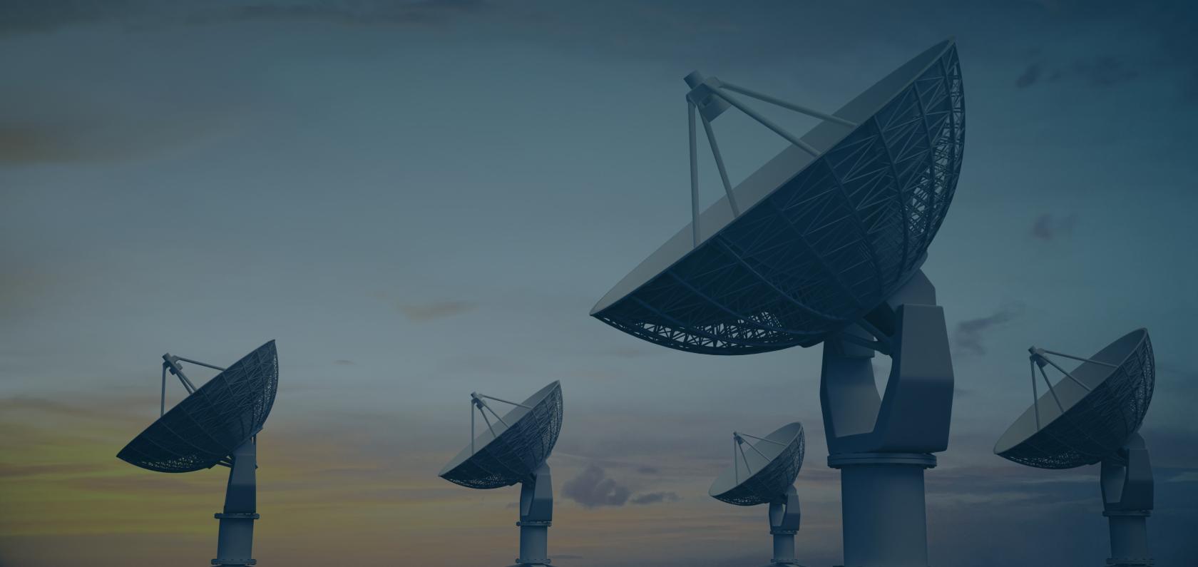 Satellite dishes pointing skyward representing cellular network technologies