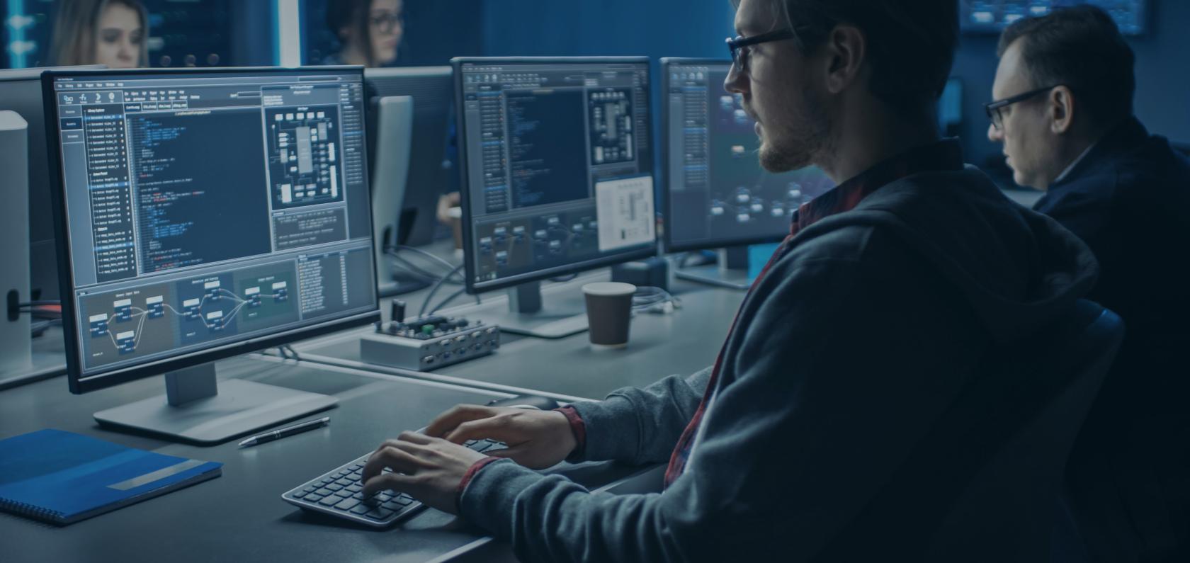 Men infront of computers top