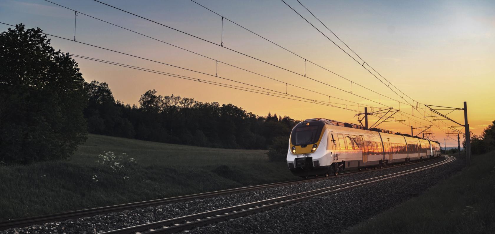 Freight train speeding along a track representing transport and logistics