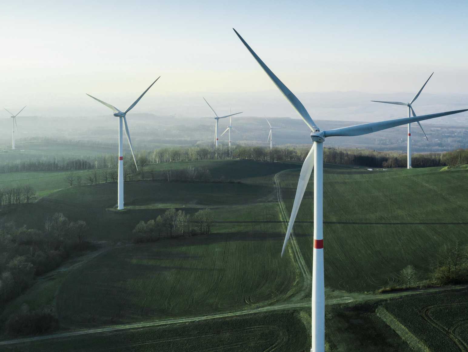 Wind turbines in field