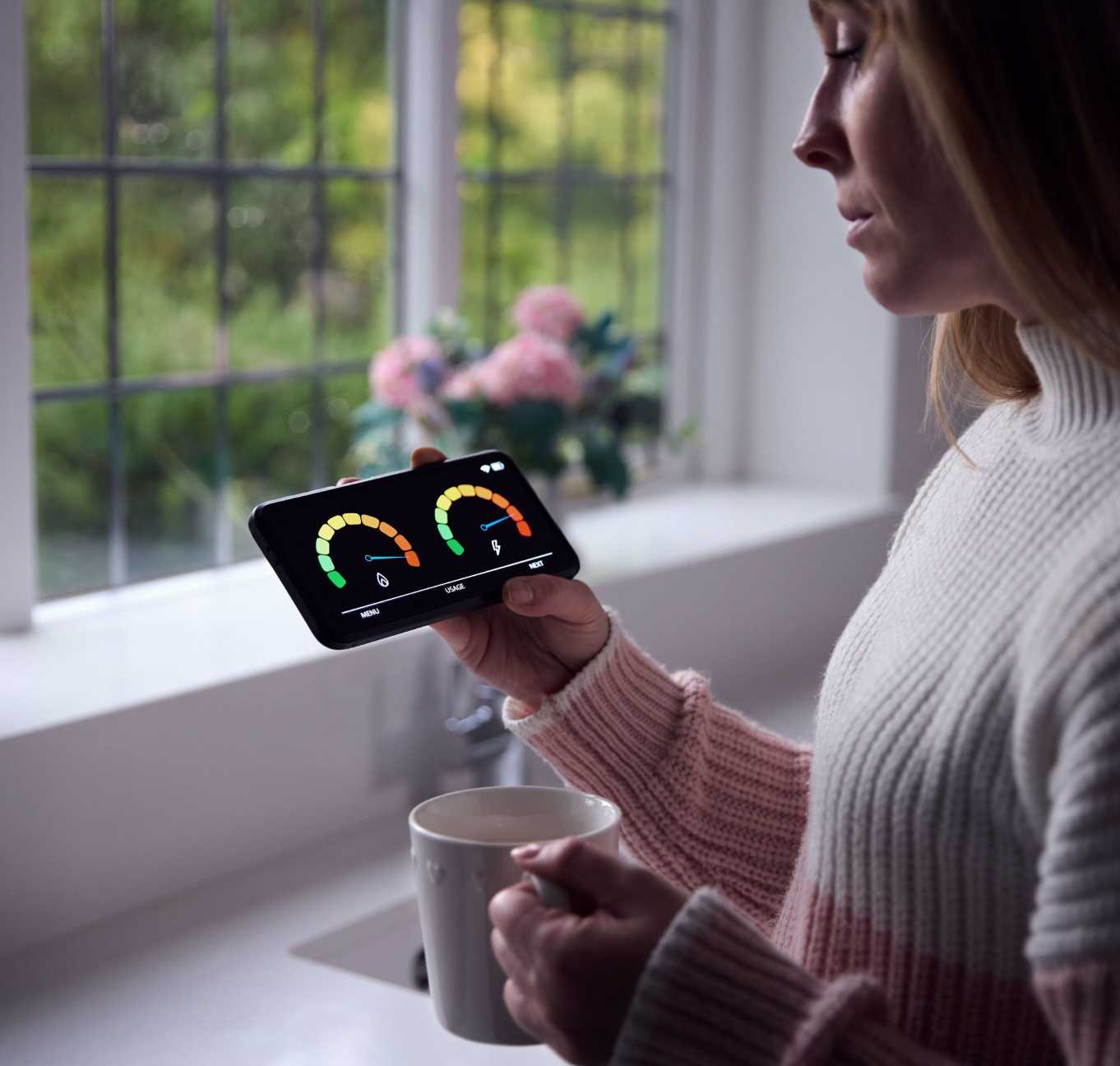 Woman looking at phone meters