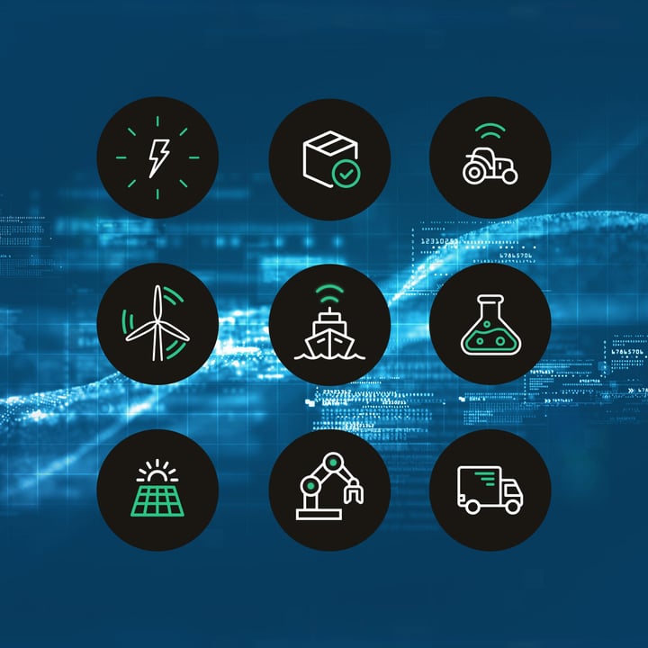 A 3x3 grid of nine Com4 IoT industry icons (energy, package tracking, smart agriculture, wind energy, maritime/shipping, chemical/liquid monitoring, solar power, robotics/manufacturing, and logistics/delivery) in white and Clean Green line-art on dark circles, set against a blue duotone digital network background.