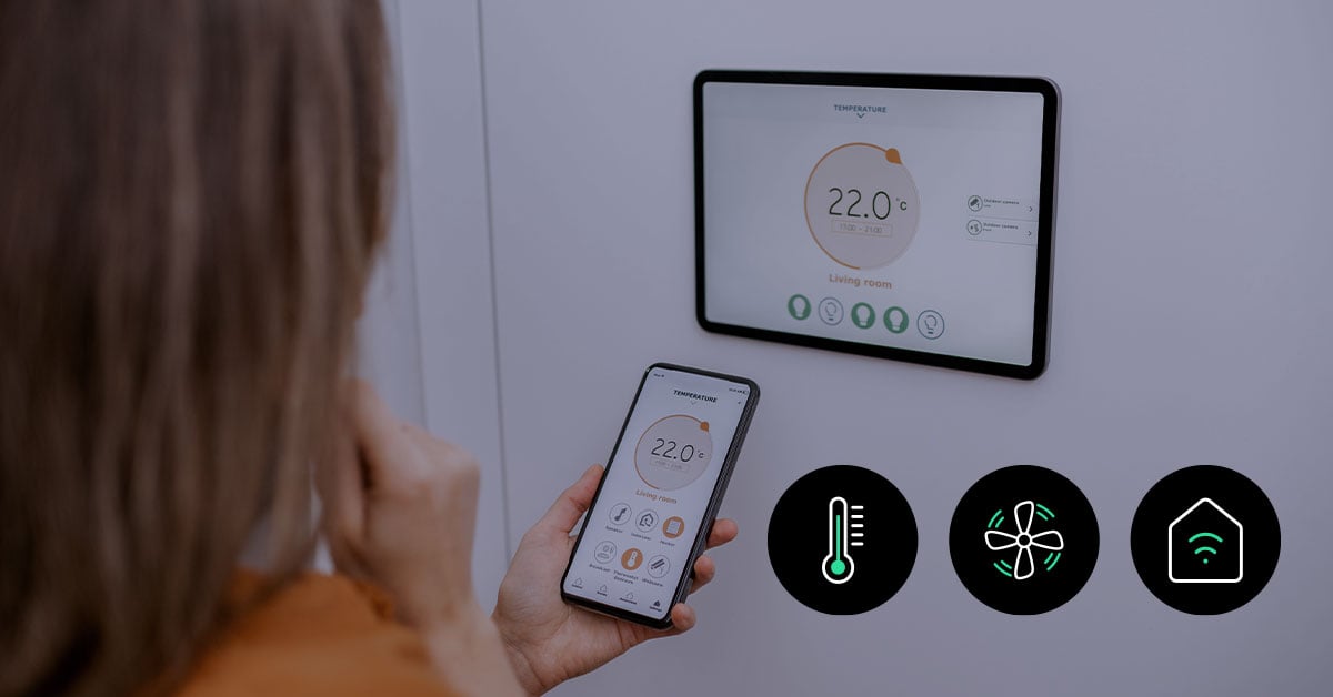 Smart home with IoT devices — a connected living room featuring a smart thermostat, automated lighting, and voice-controlled assistant, all managed through a mobile app