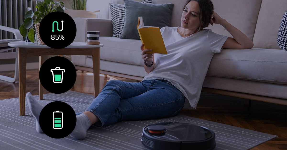 Woman relaxing at home, comfortably surrounded by IoT devices such as smart speakers, automated lighting, and connected appliances, all seamlessly linked through reliable connectivity