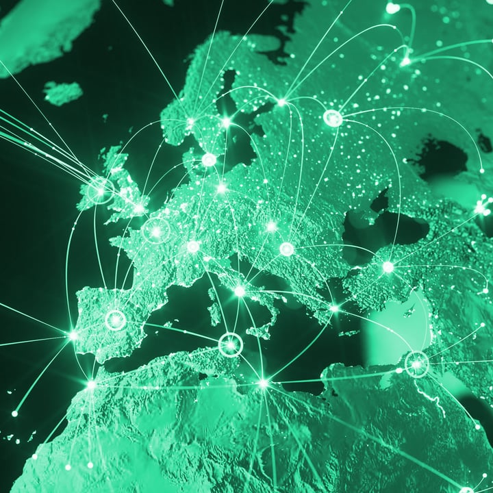 A green-toned digital map of Europe showing glowing network nodes and connection lines linking major cities, representing global IoT connectivity.