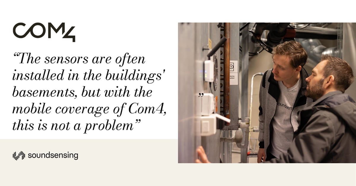 Two engineers using IoT-based predictive maintenance with sound sensing technology.