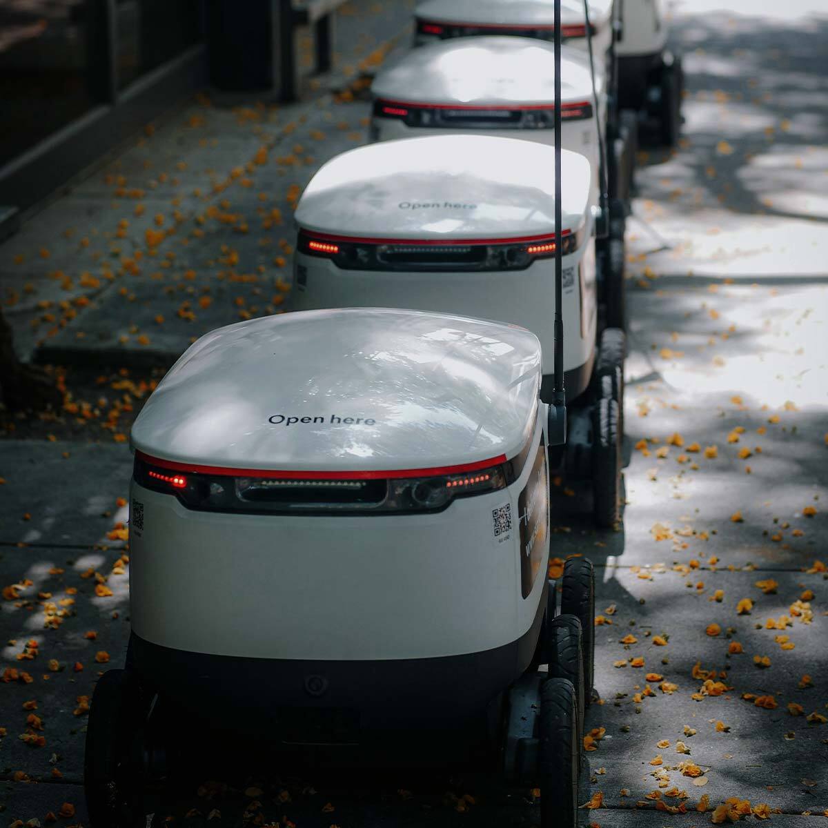 Industry 4.0 food production with robots transferring goods using cellular IoT connectivity.