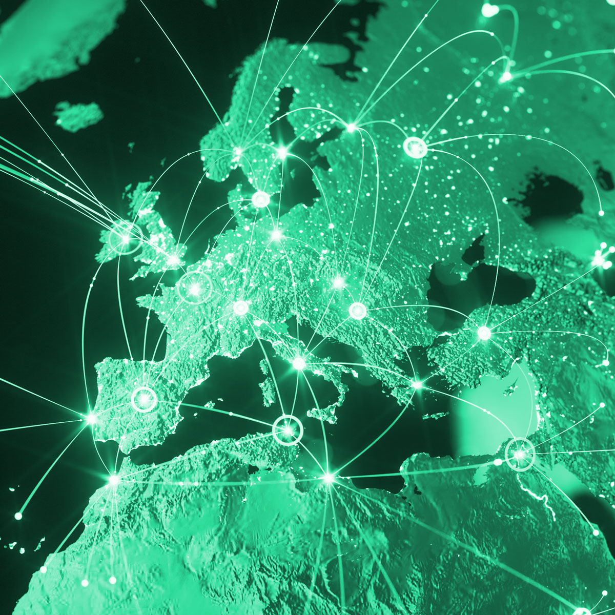 A green-toned digital map of Europe showing glowing network nodes and connection lines linking major cities, representing global IoT connectivity.